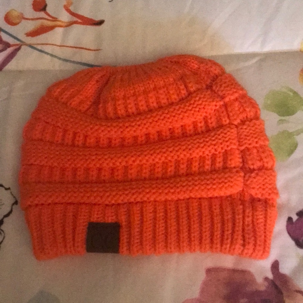 Orange knit ponytail cap